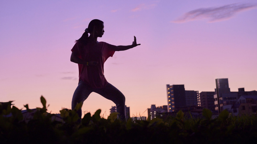 An Apple Watch wearer practices Tai Chi.